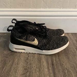 Nike black & gold sneakers